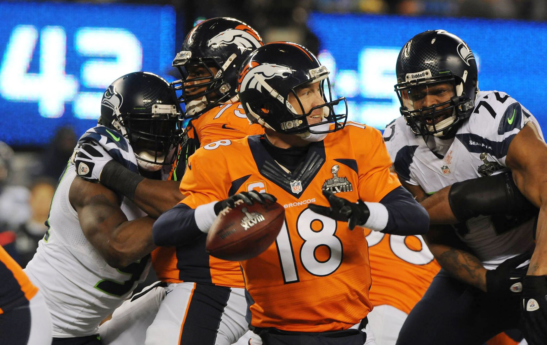Broncos quarterback Peyton Manning is pressured by the Seahawks defense in the 4th quarter of the Super Bowl at Metlife Stadium in East Rutherford, New Jersey on February 2, 2014. (The Gazette/Jerilee Bennett)